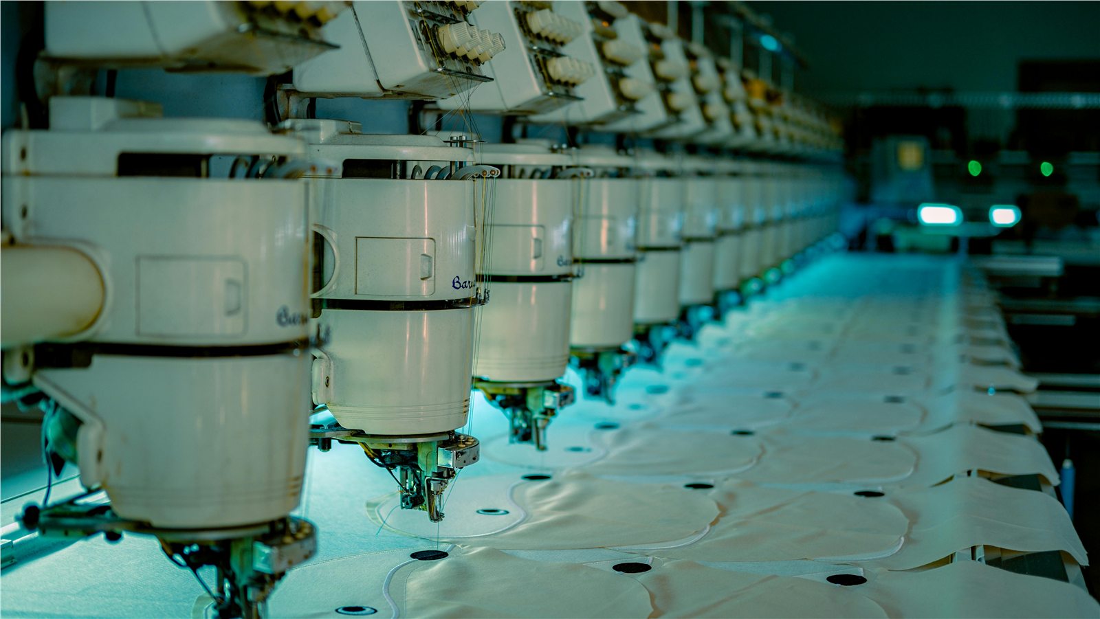 Industrial multi-head embroidery production