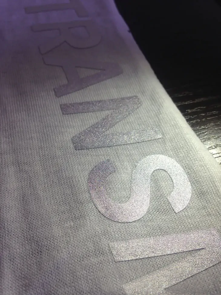 Custom reflective logo printing on a garment
