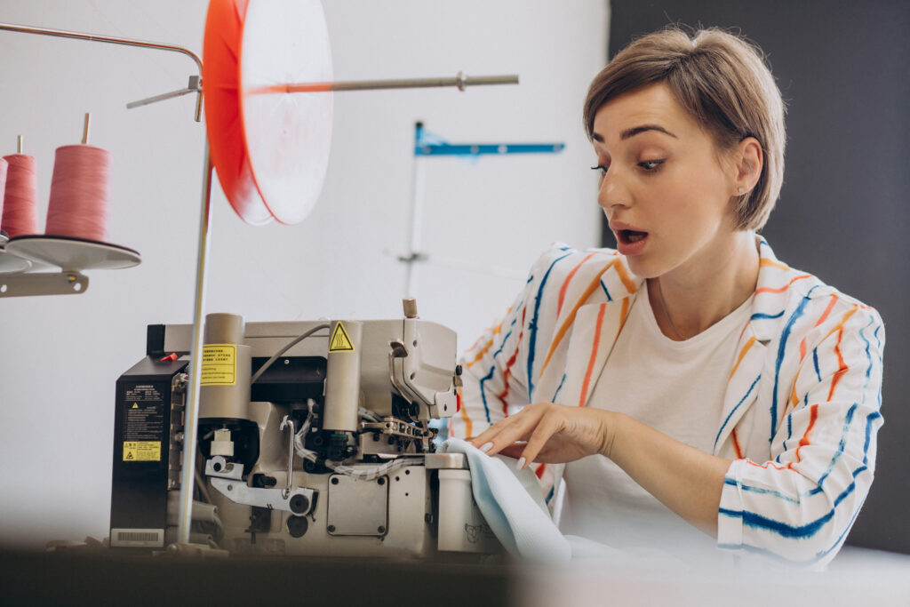female tailor working with sewing machine